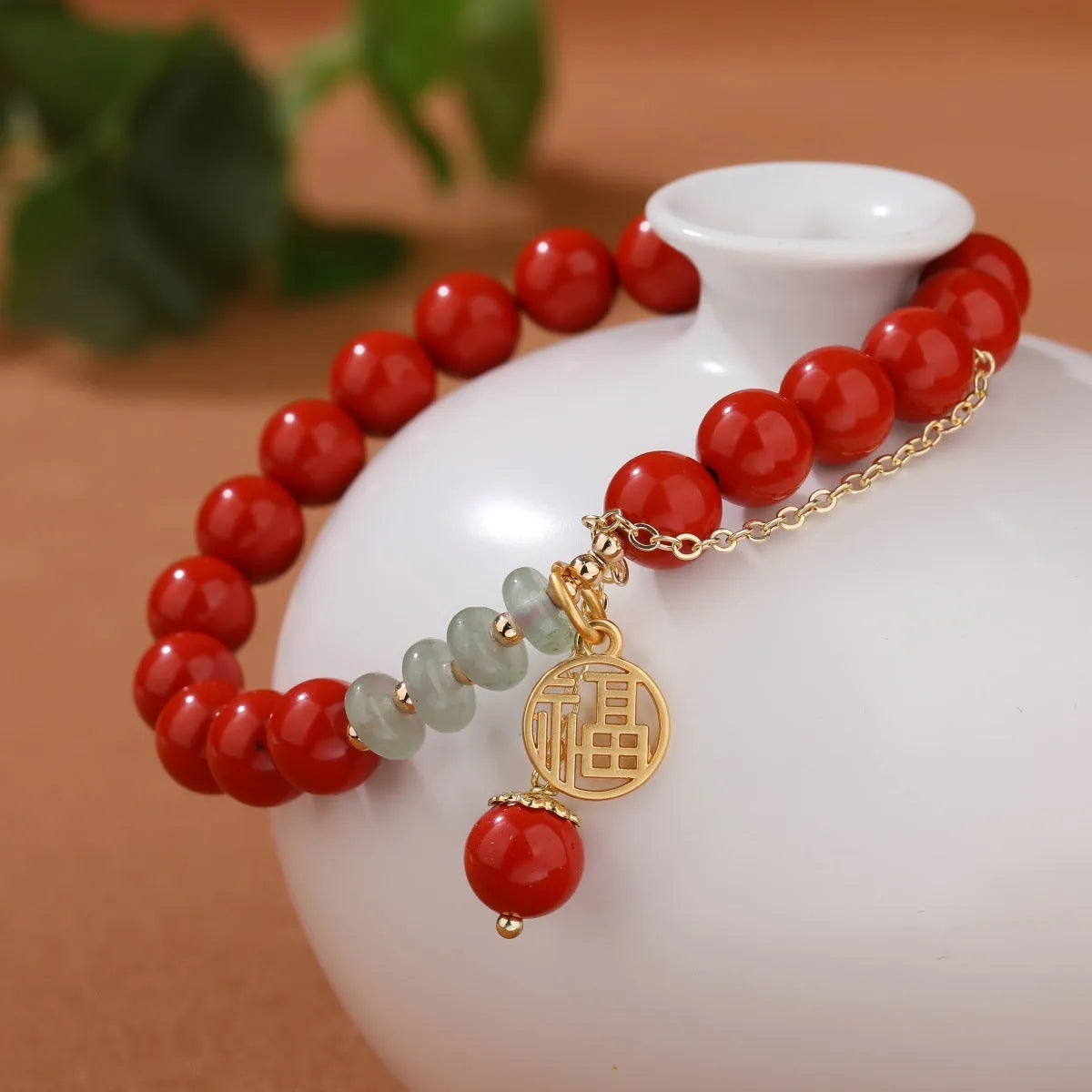 Retro red sand cinnabar bracelet with fu character charm, jade ornament, and 8mm tassel
