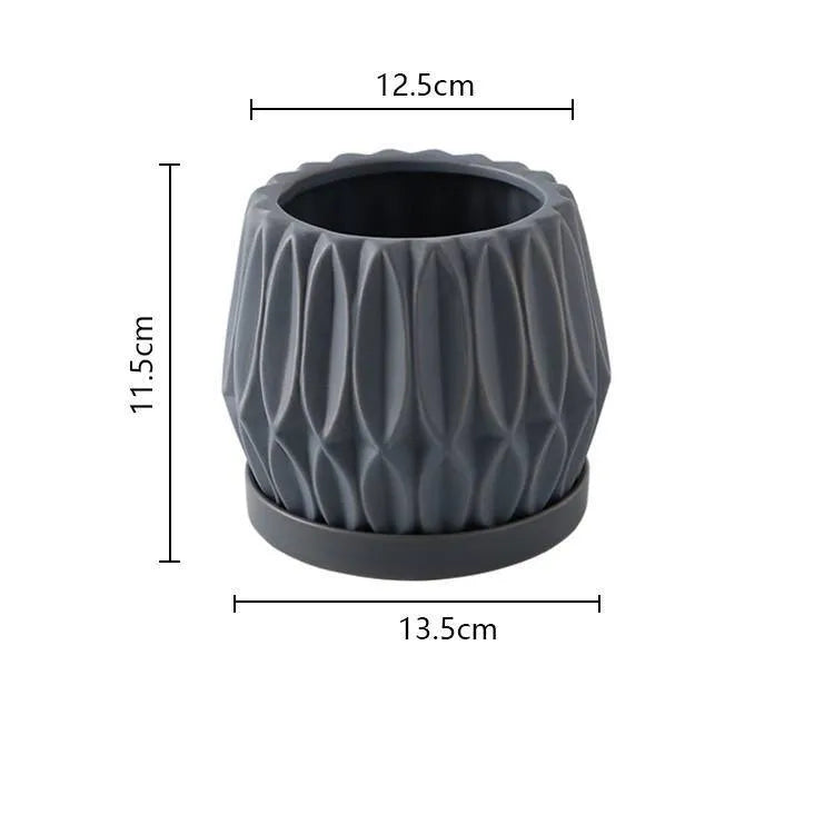 Medium grey ceramic tabletop plant pot for flowers and green plants