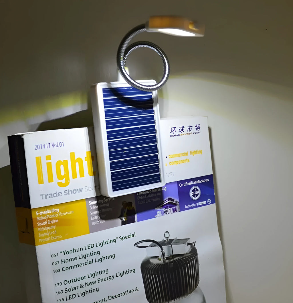 White plastic solar-powered LED garden light with a button switch, shown for outdoor use.