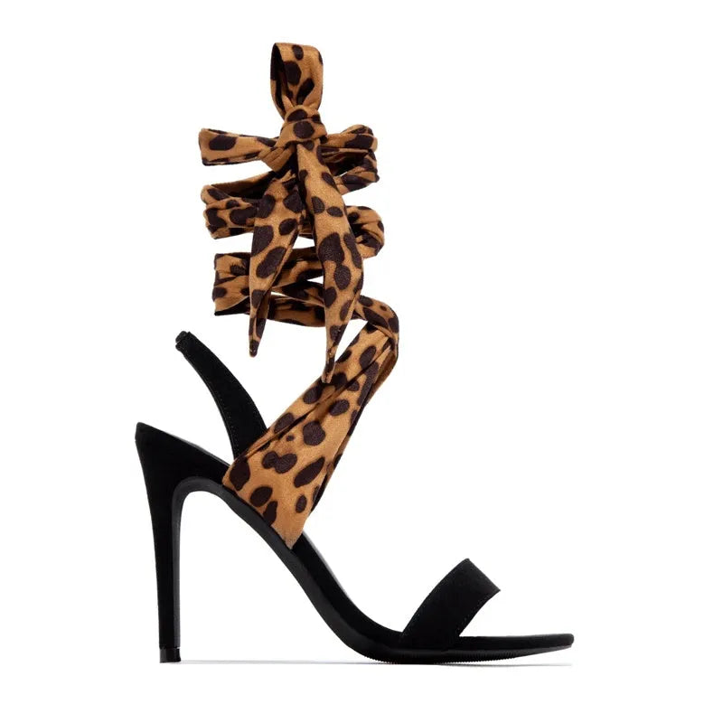 Light brown women's high heel sandals with leopard print and criss-cross ankle straps.
