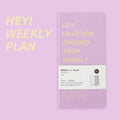 Weekly diary handbook open on a weekly planner page, showing blue cover option.