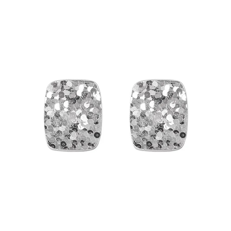 Pair of crushed ice square 925 silver stud earrings with white gold colour finish and geometric carved surface