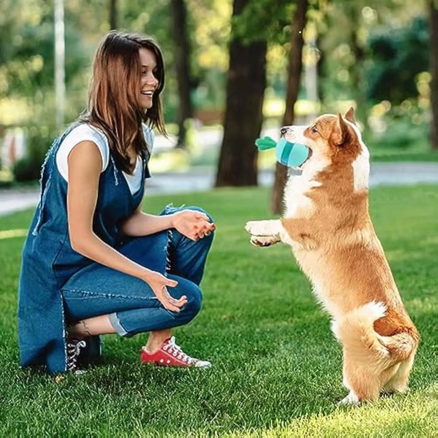 Blue and green durable rubber interactive treat dispensing tumble ball dog toy with small holes