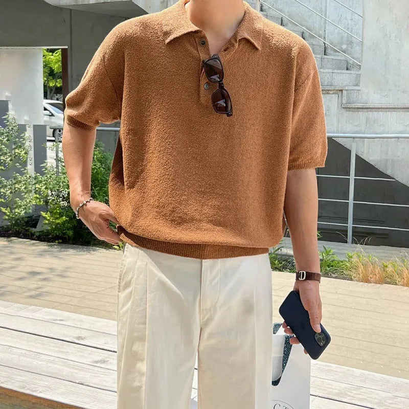 A man's caramel coloured retro knitted polo shirt with short sleeves and an asymmetric design detail.