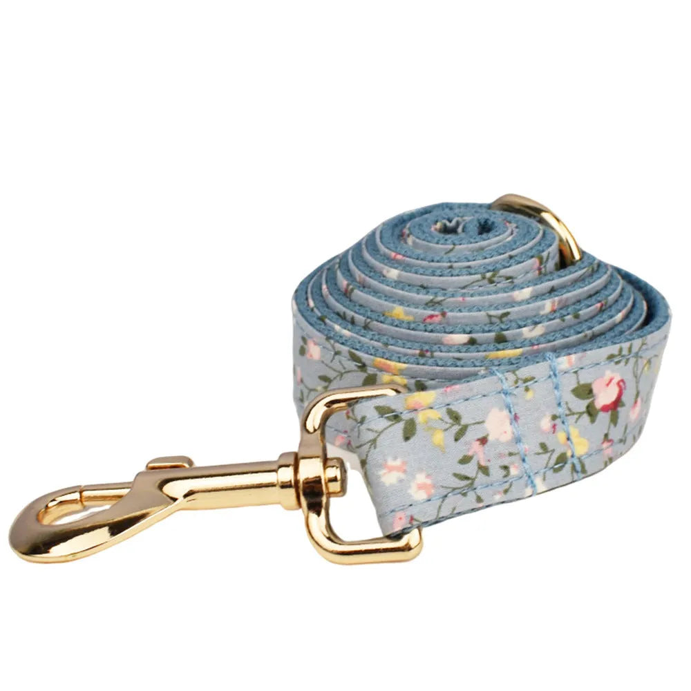 Blue floral pattern dog collar set with matching leash, vest, bow and accessories for small dogs