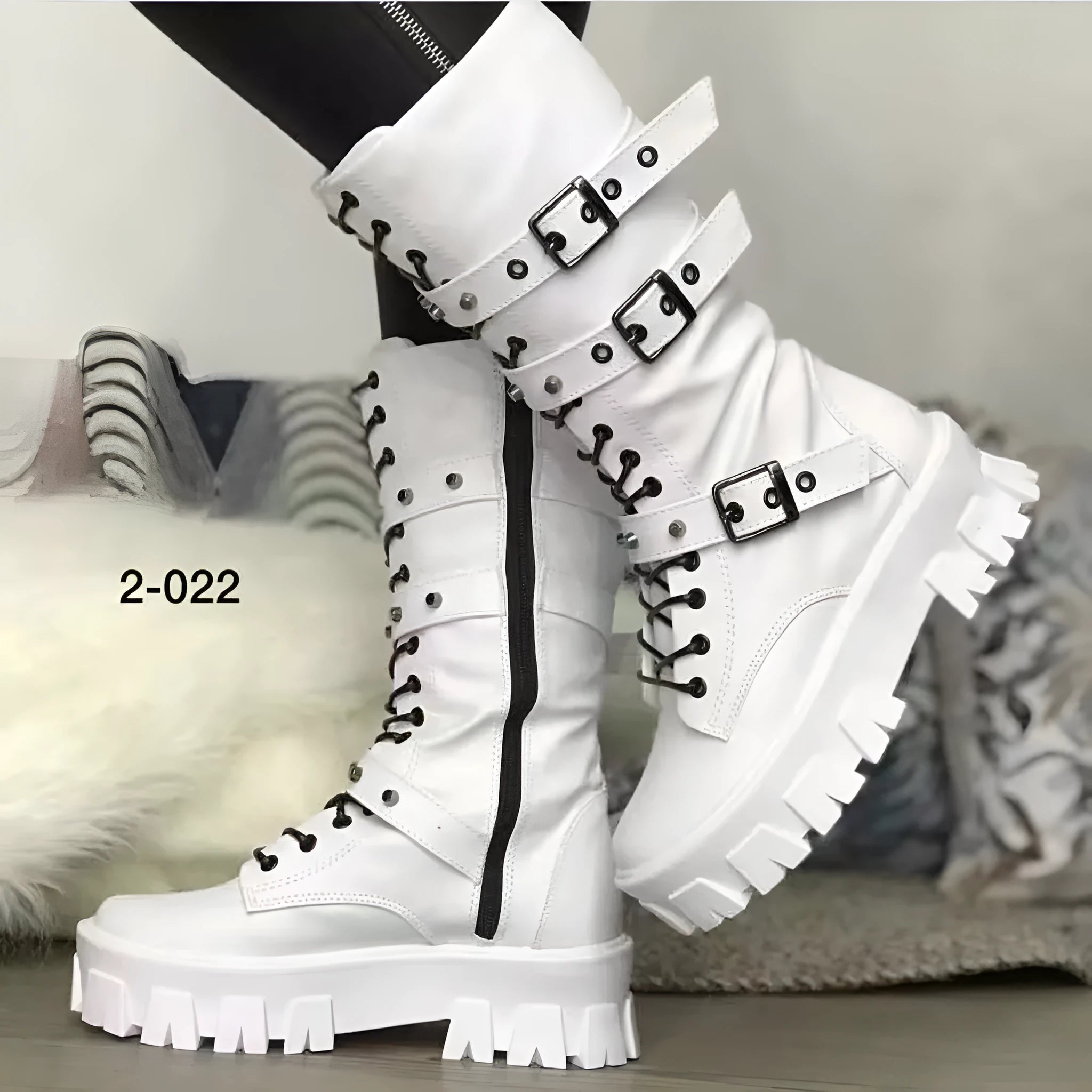 Women's black mid-calf knight boots with a large metal buckle and side zipper detail.