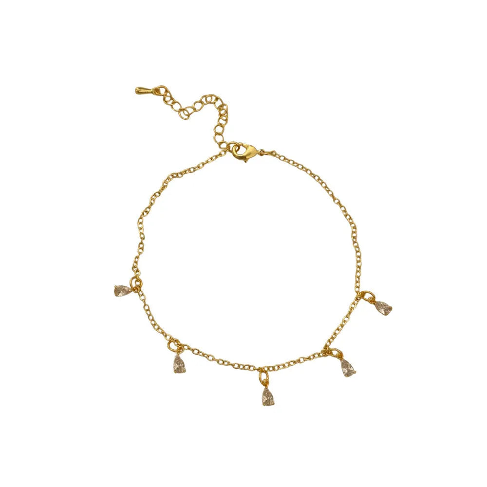 A women's zircon jewellery set showing a geometric meteor shower necklace, matching earrings, and an anklet on a white background.