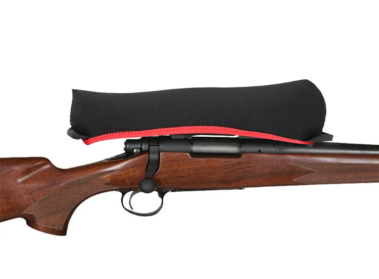 Reversible neoprene scope cover for rifle or shotgun in black and camouflage print lying flat