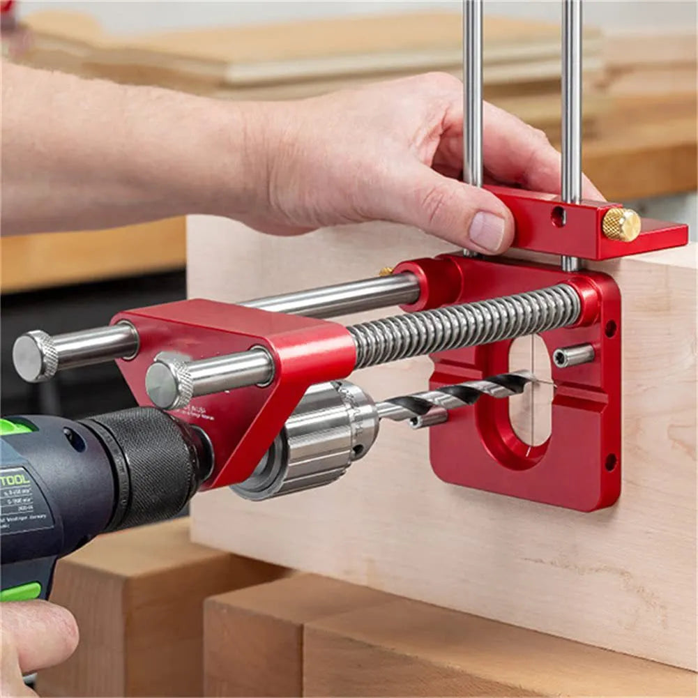 Woodworking drill locator with metal body and red or black plastic guide for drilling wood