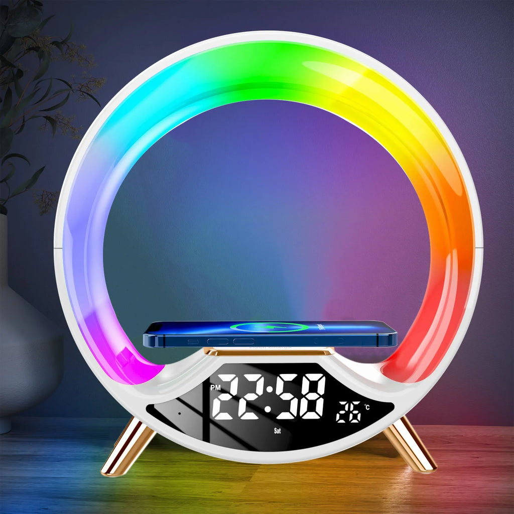 O Light three-in-one wireless charging Bluetooth speaker and night light on a bedside table.