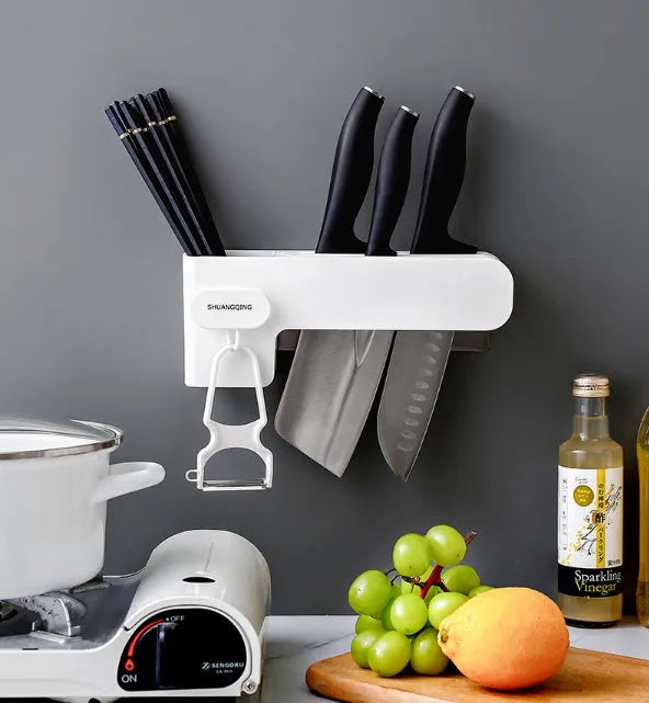 White plastic knife rack on kitchen countertop showing modern simple design