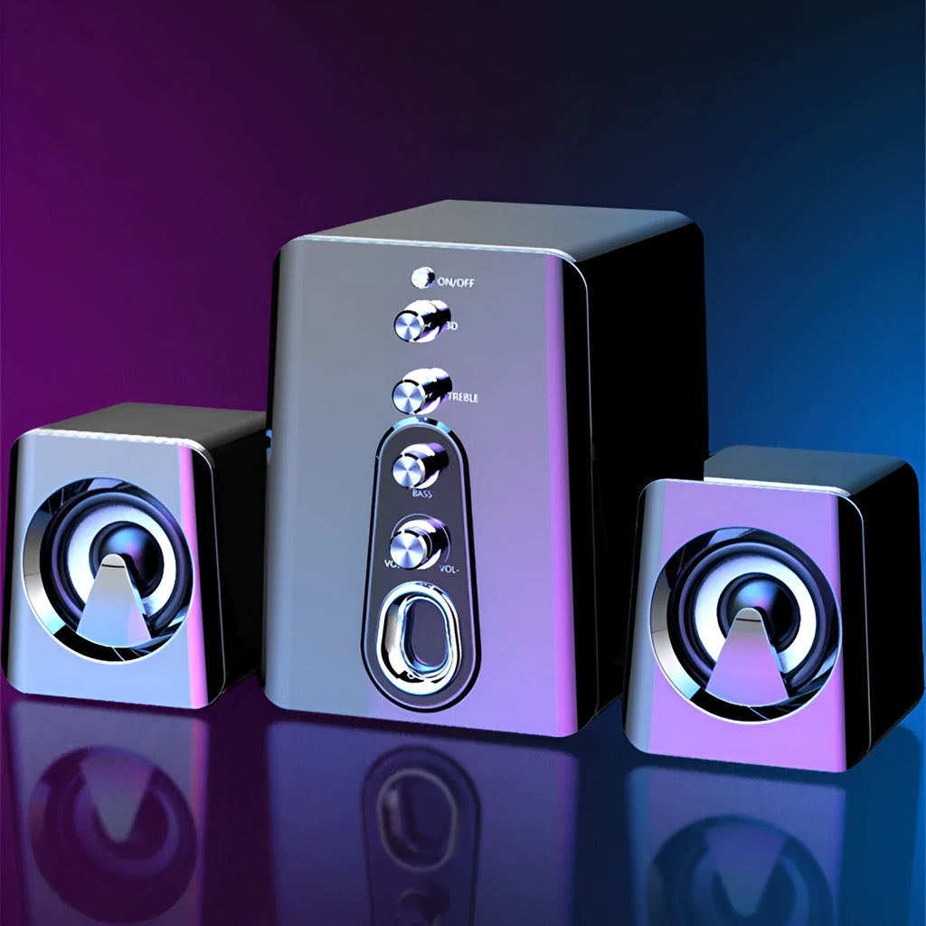 Mini black and white USB-powered 2.1 computer speaker system with subwoofer on a desktop.