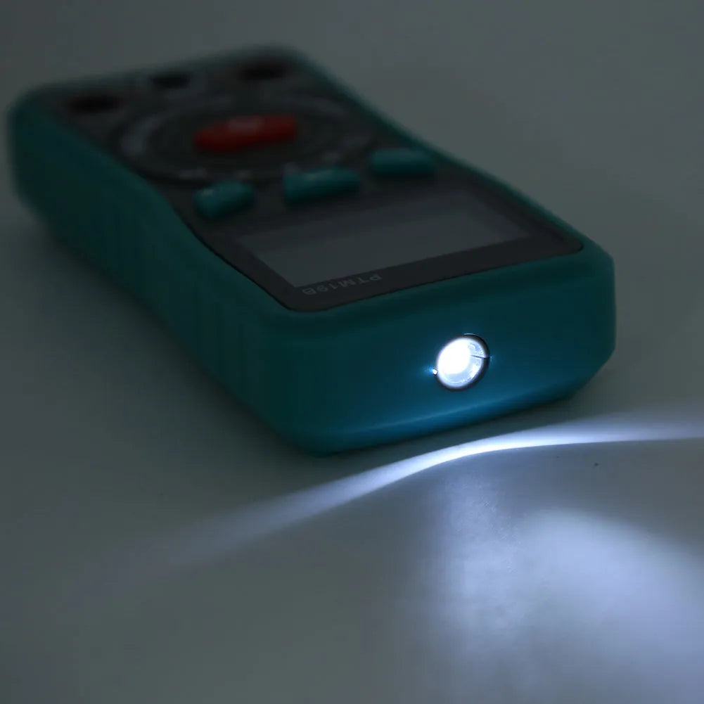 Green universal digital multimeter with automatic ranging and LED display on a table.