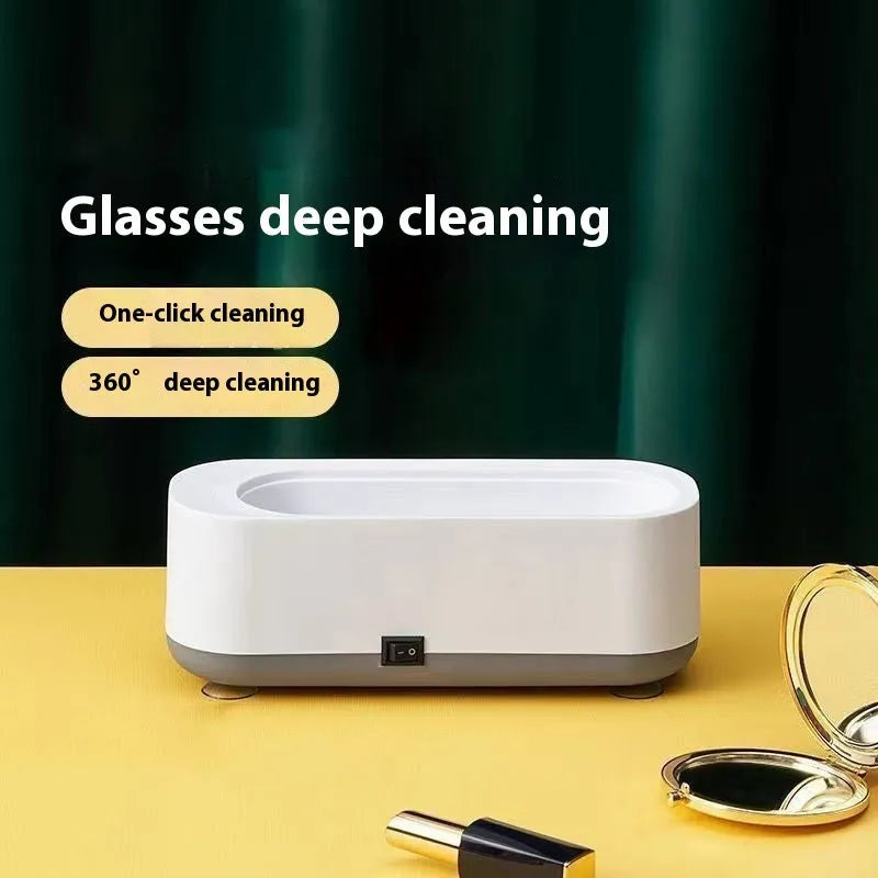 Small purple light ultrasonic glasses washing machine with USB cable and mirror cloth on white background