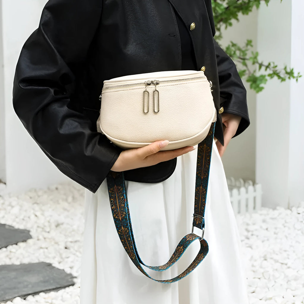 Women's soft PU messenger bag with saddle shape design and single shoulder strap in black colour