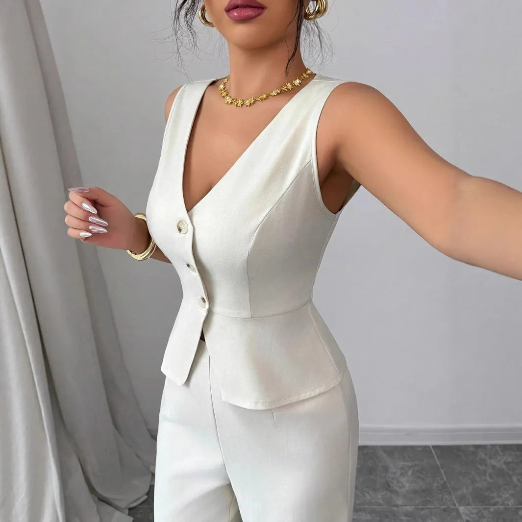 Women's solid colour sleeveless vest and high-waist trousers two-piece set in polyester fabric.