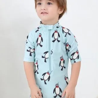 Boy's penguin print long sleeve swimsuit one-piece with matching swim cap for sun protection