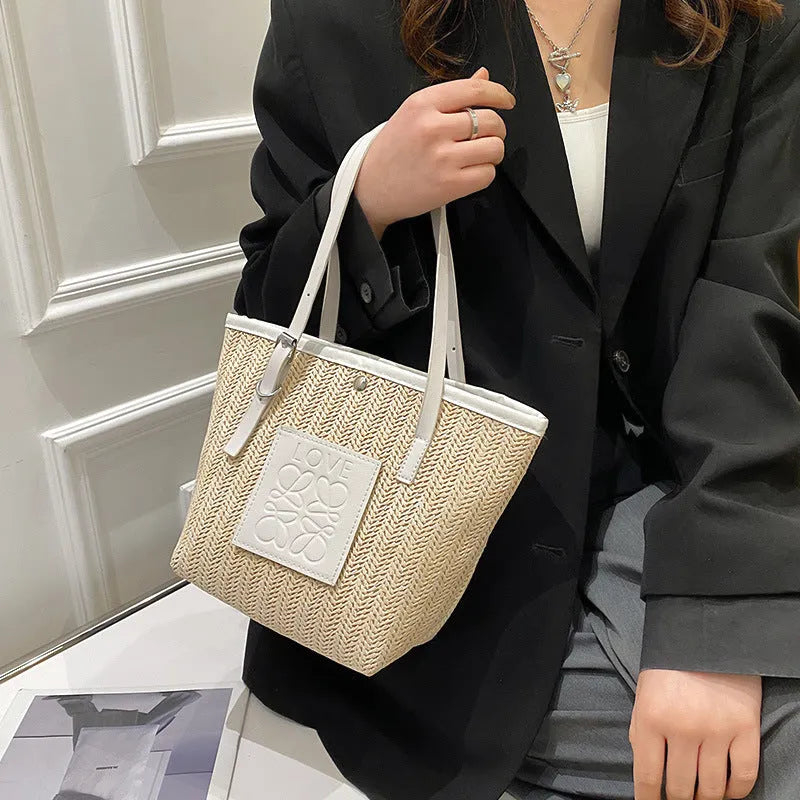 White straw woven women's shoulder bag with three-dimensional pockets showing European retro styling details
