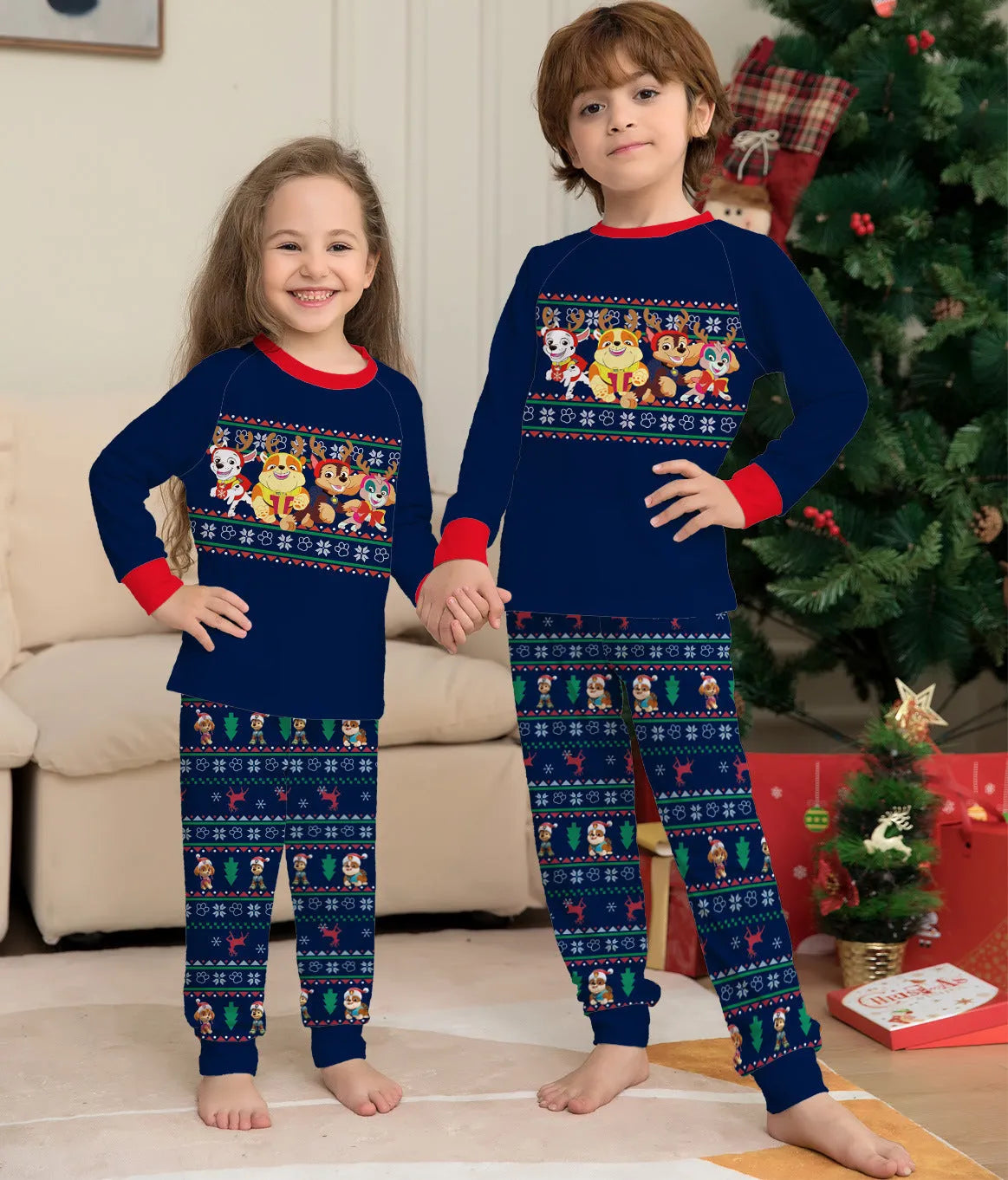 Matching family wearing red plaid Christmas deer print cotton pyjamas, including adults, children, and a dog.