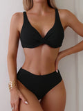 Women's black ribbed texture two-piece bikini set on a mannequin, showing briefs style.