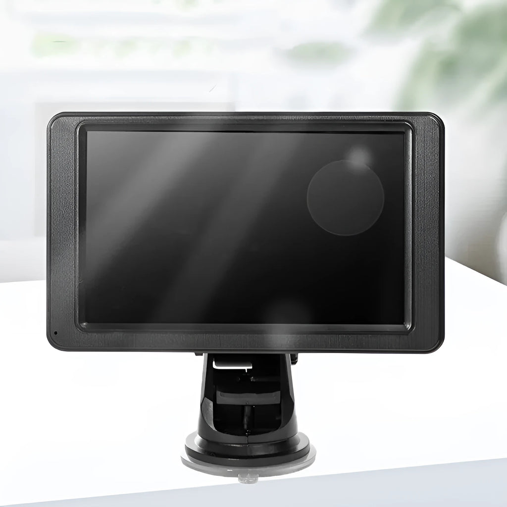 Black 7-inch car MP5 player with mounting bracket and cables on a dashboard.