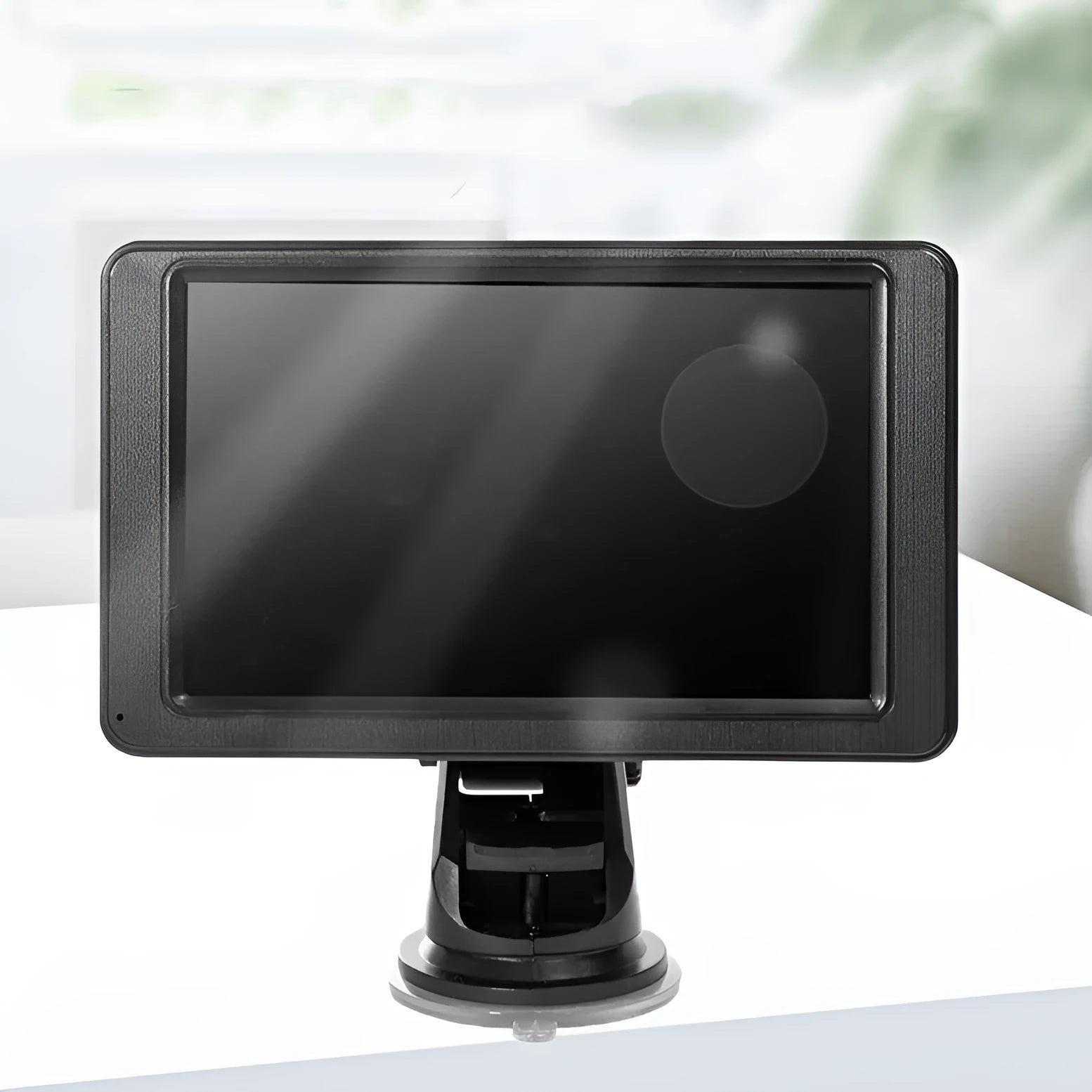 Black 7-inch car MP5 player with mounting bracket and cables on a dashboard.