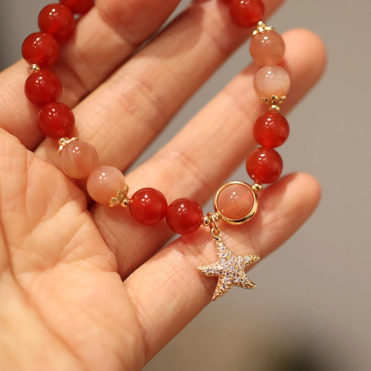 Handmade women's bracelet with 8mm red agate and sunstone beads in ethnic Xiangyun style