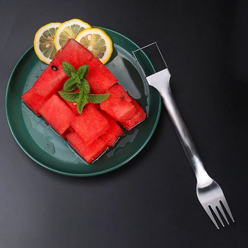 Silver stainless steel watermelon fork slicer with extended handle and rounded fork head