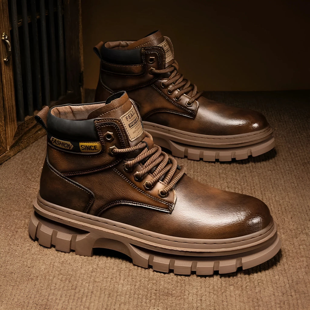 Men's brown mid-calf Martin boots with front laces and round toe on a rubber sole.