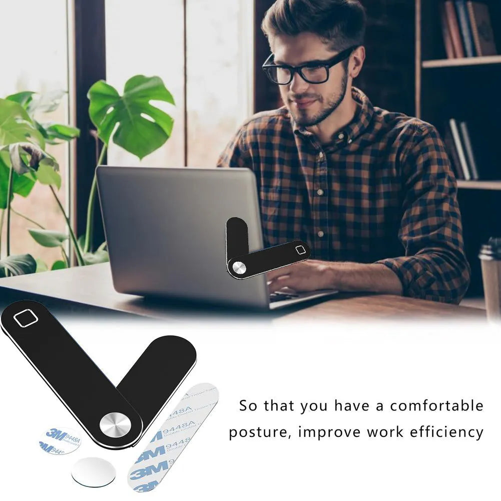 Black magnetic laptop phone holder attached to computer monitor with smartphone mounted
