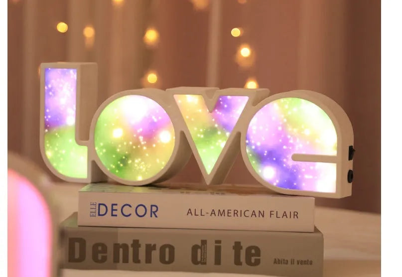 Rainbow style LOVE word LED decorative light with USB cable, measuring 35.5cm by 13.5cm.