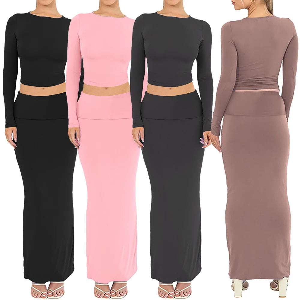 Women's autumn two-piece suit set in polyester, showing slim fit top with three-quarter sleeves and matching long skirt.