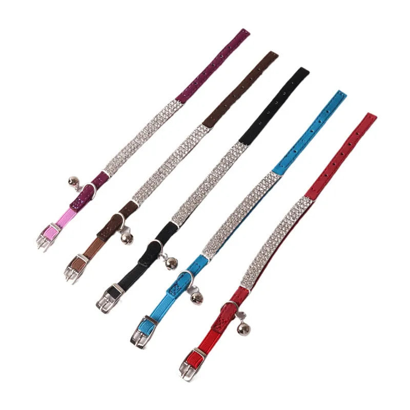 Soft flocked cat collar with an elastic buckle shown in multiple colours.