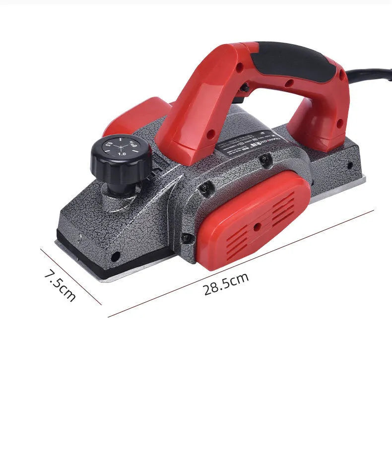 Red desktop electric wood planer with aluminium body showing 82mm planing width