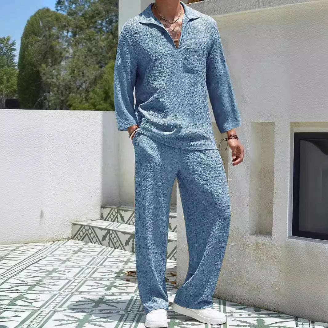 Men's casual polyester commuter suit in lake blue, showing shirt jacket and trousers laid flat.