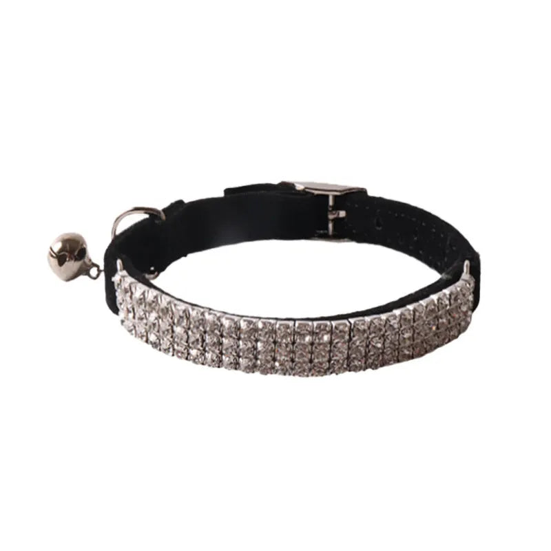 Soft flocked cat collar with an elastic buckle shown in multiple colours.