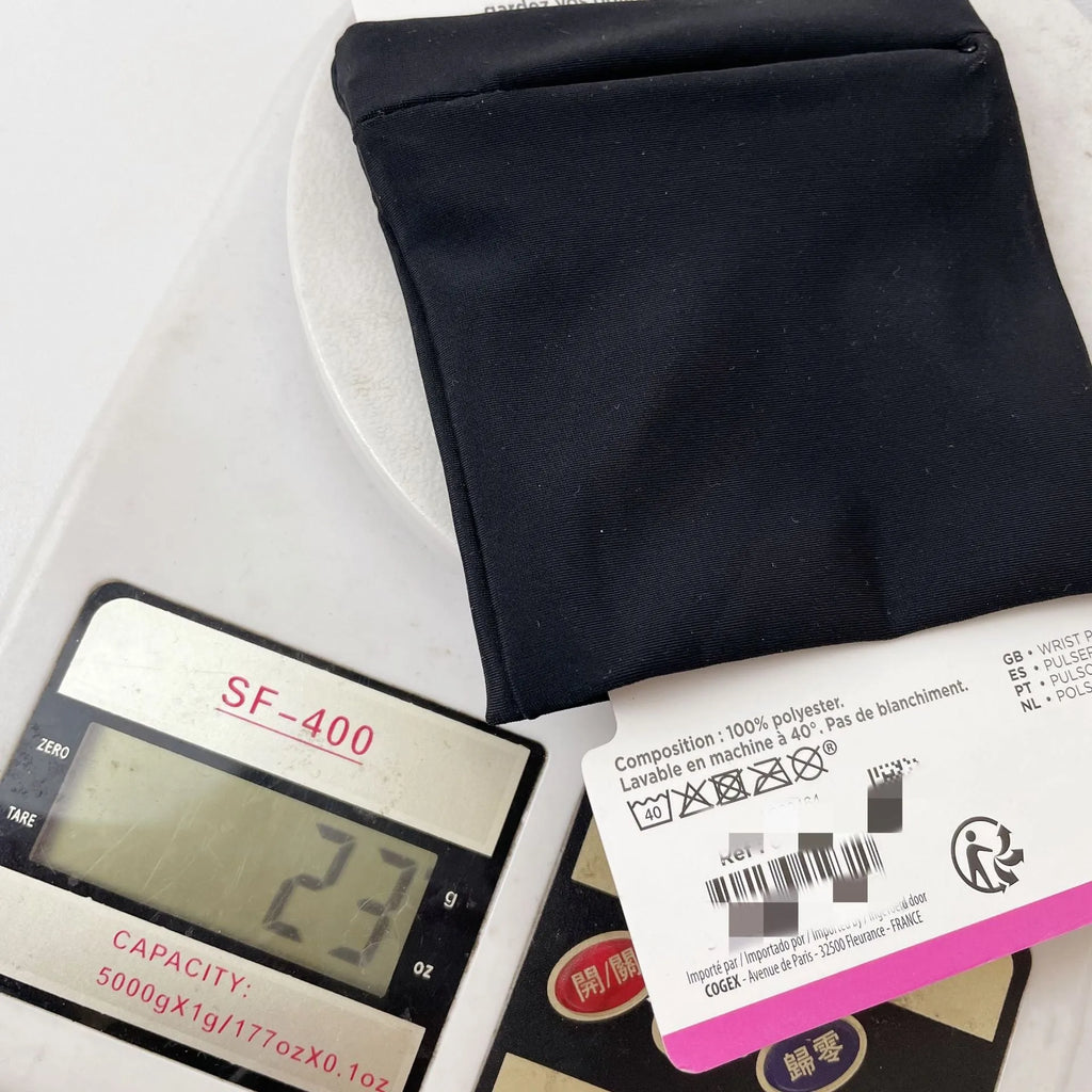 Adjustable wrist armband with a phone compartment, shown for camping and fitness use.