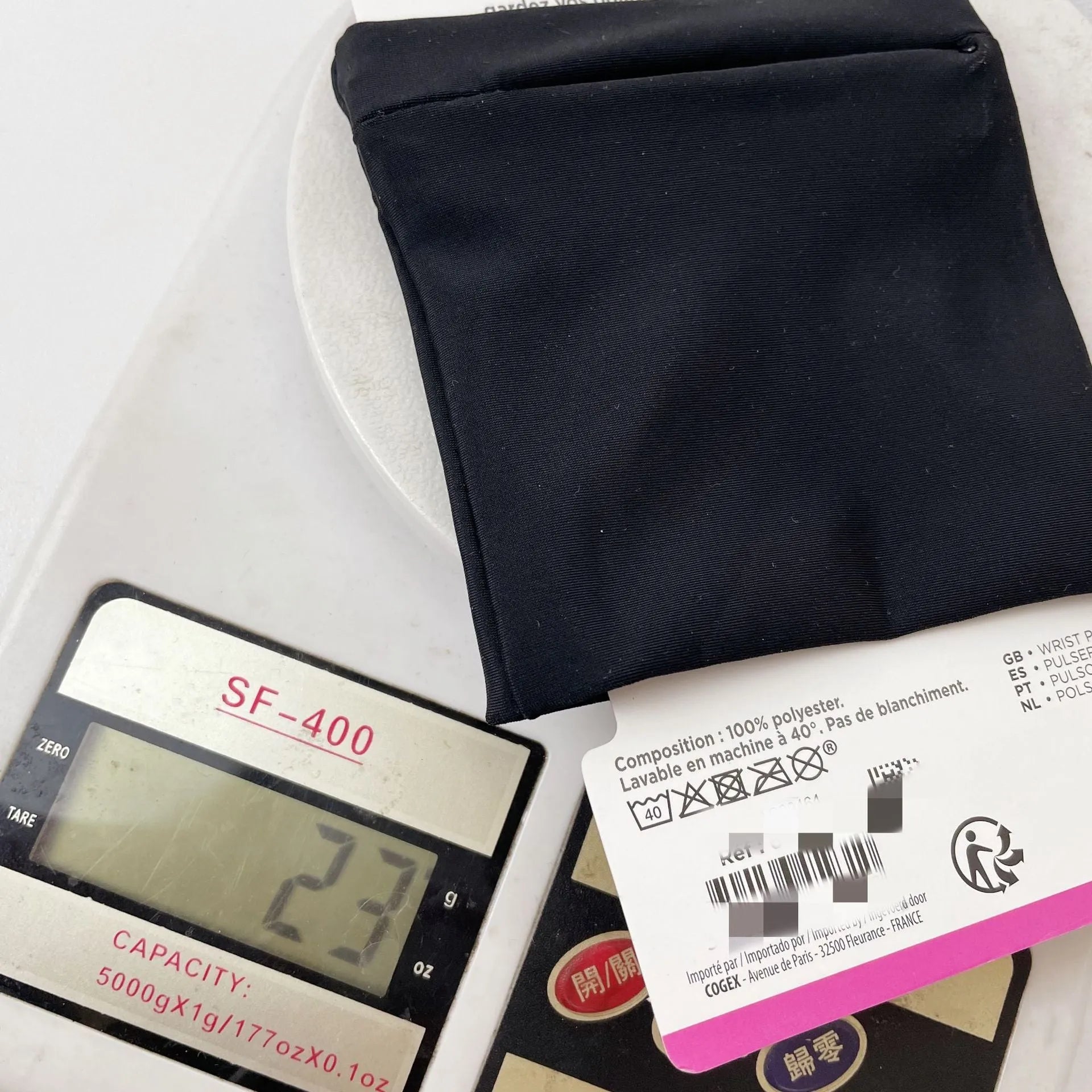 Adjustable wrist armband with a phone compartment, shown for camping and fitness use.