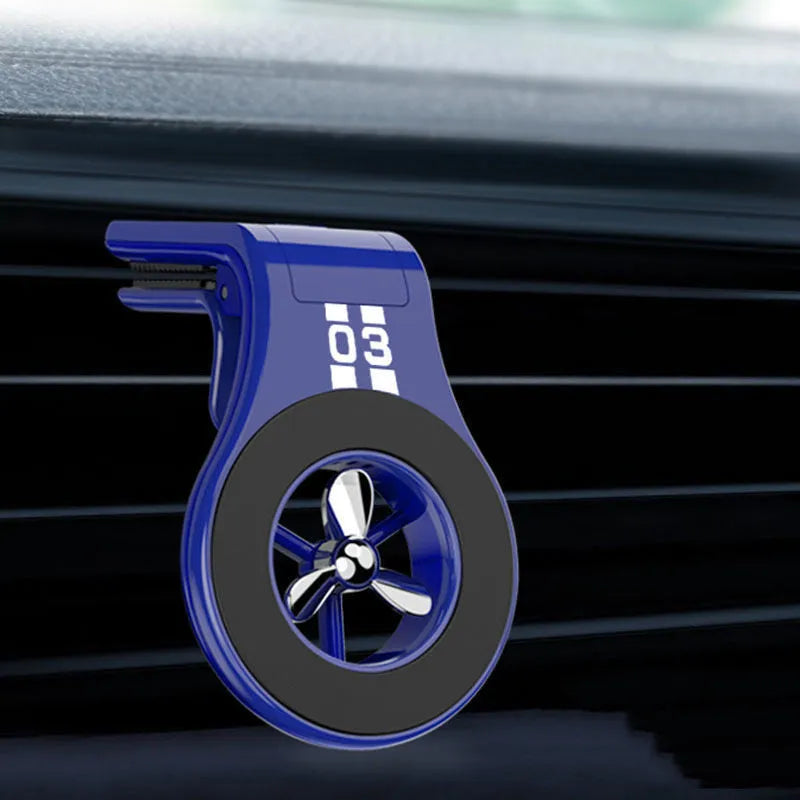 Black magnetic car phone holder mounted on vehicle air vent with smartphone attached