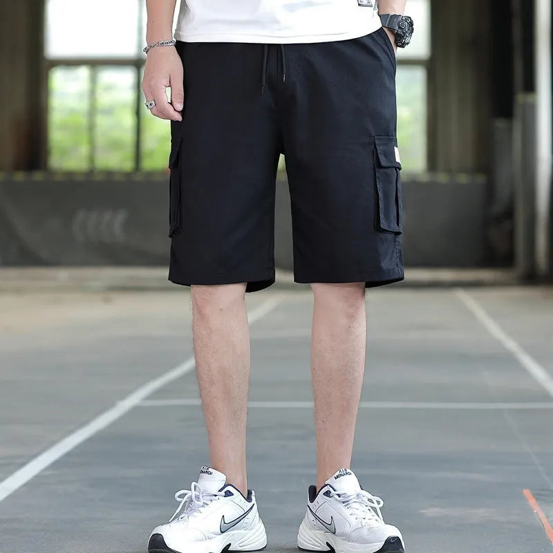 Men's loose Korean-style trousers in black, khaki, army green, and camouflage colours.