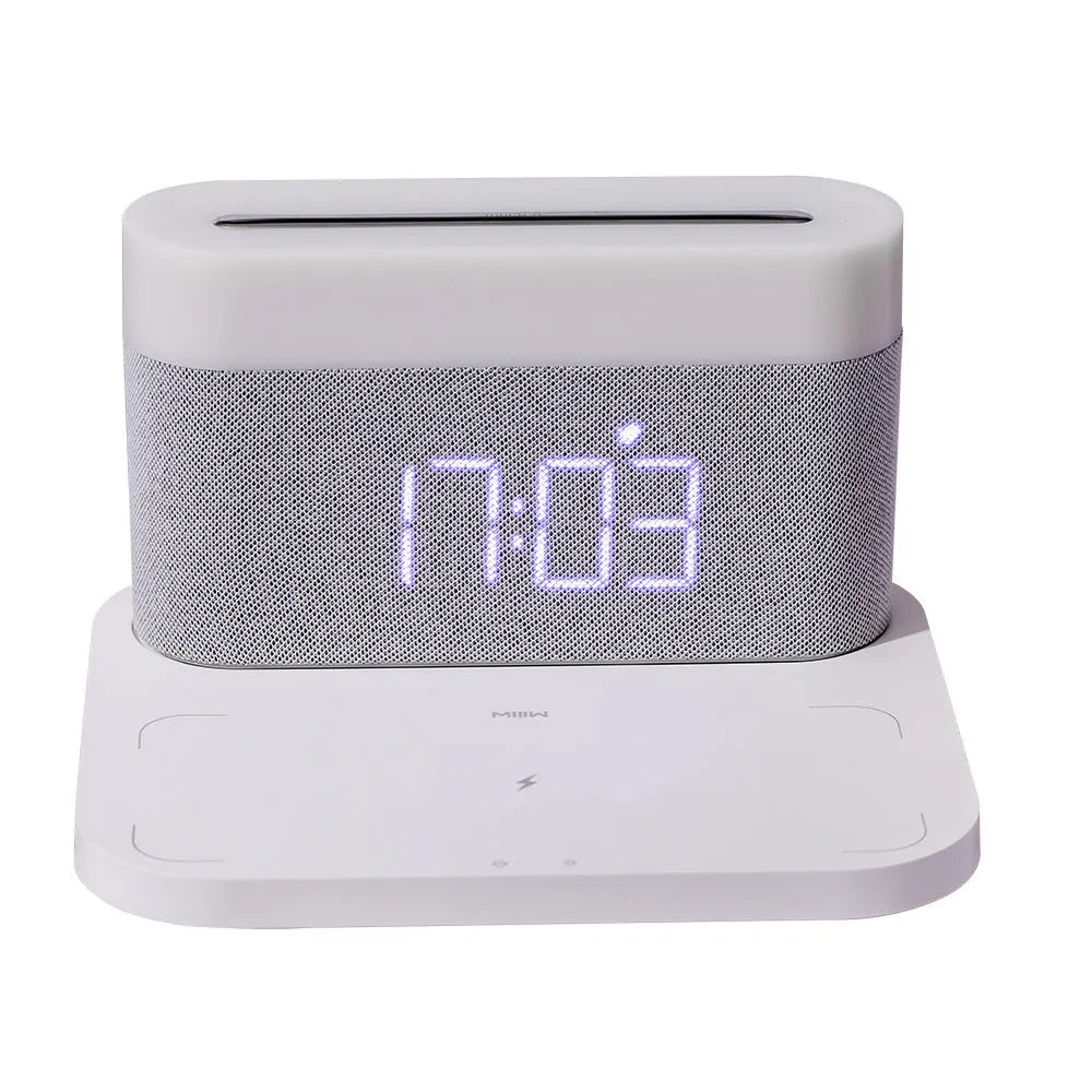 Black or white table lamp with wireless phone charging pad and digital clock display