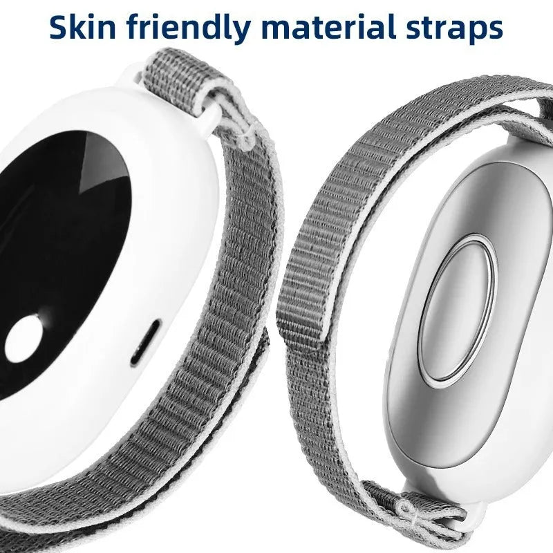 White intelligent sleep aid device handheld remote control with sleep bracelet on a dark background.