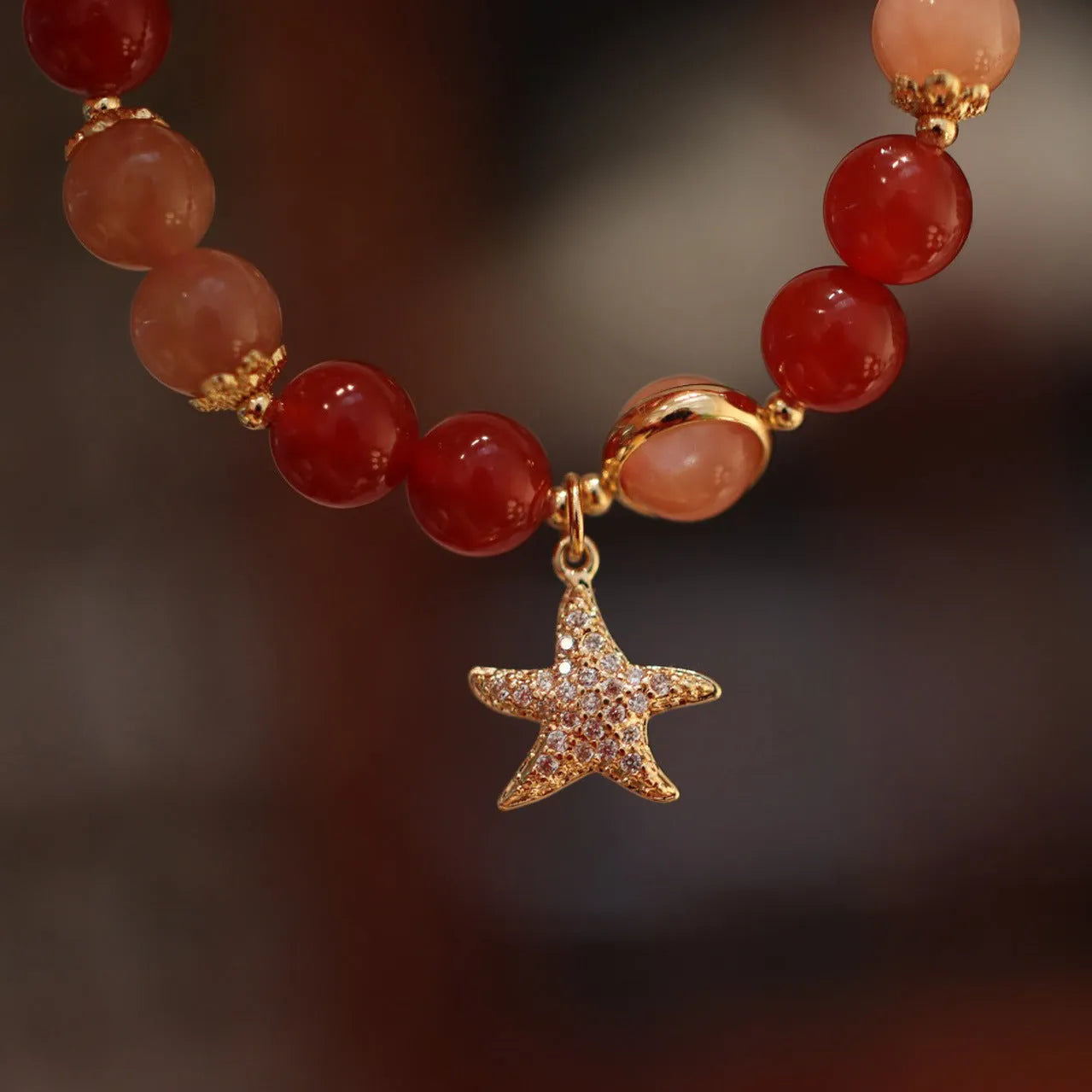 Handmade women's bracelet with 8mm red agate and sunstone beads in ethnic Xiangyun style