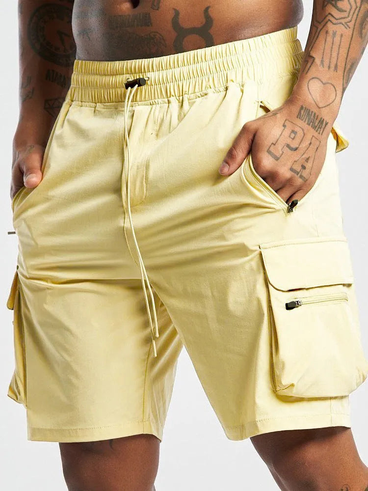Man's black quick-drying sports shorts with elastic waistband for fitness and running activities.