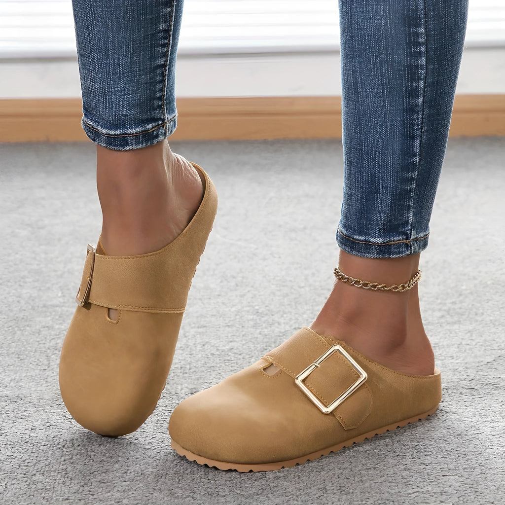Women's closed toe canvas slipper in apricot colour showing low top design and elasticated heel.