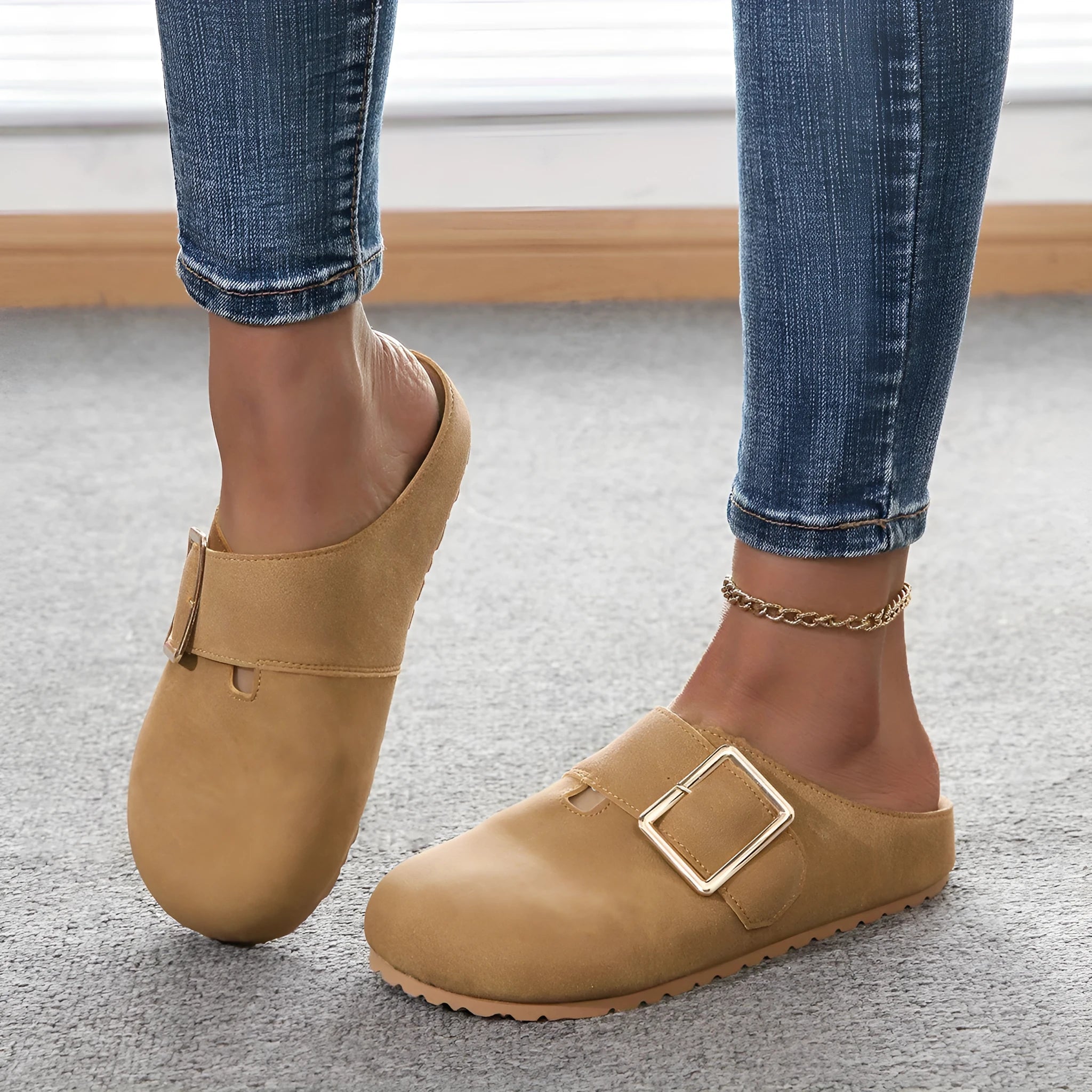 Women's closed toe canvas slipper in apricot colour showing low top design and elasticated heel.
