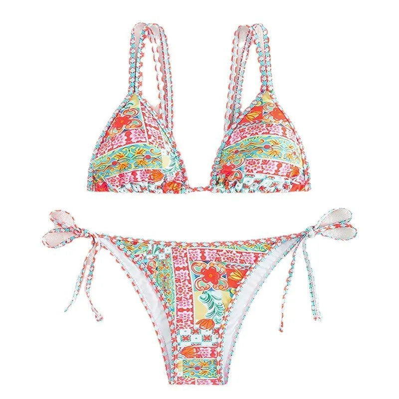 Women's lace-up split swimsuit in picture colour, showing backless design and adjustable ties.
