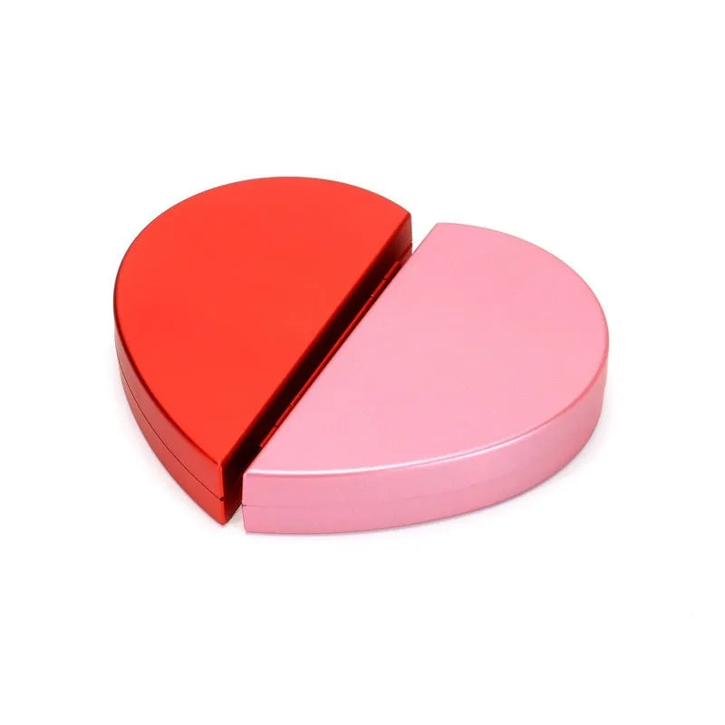 Red heart-shaped rotating plastic ring box for jewellery presentation