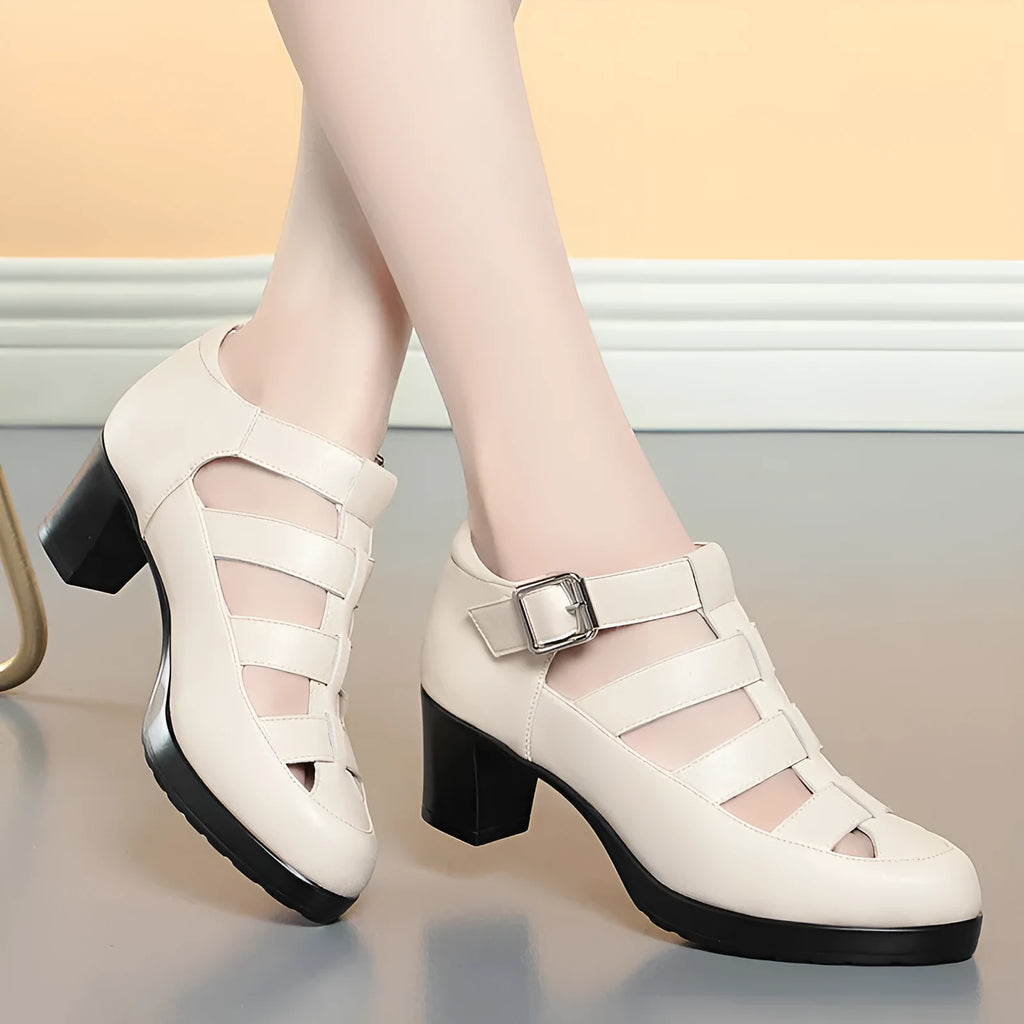 Beige women's closed toe sandals with a chunky heel, woven hollowed upper, and ankle strap buckle.