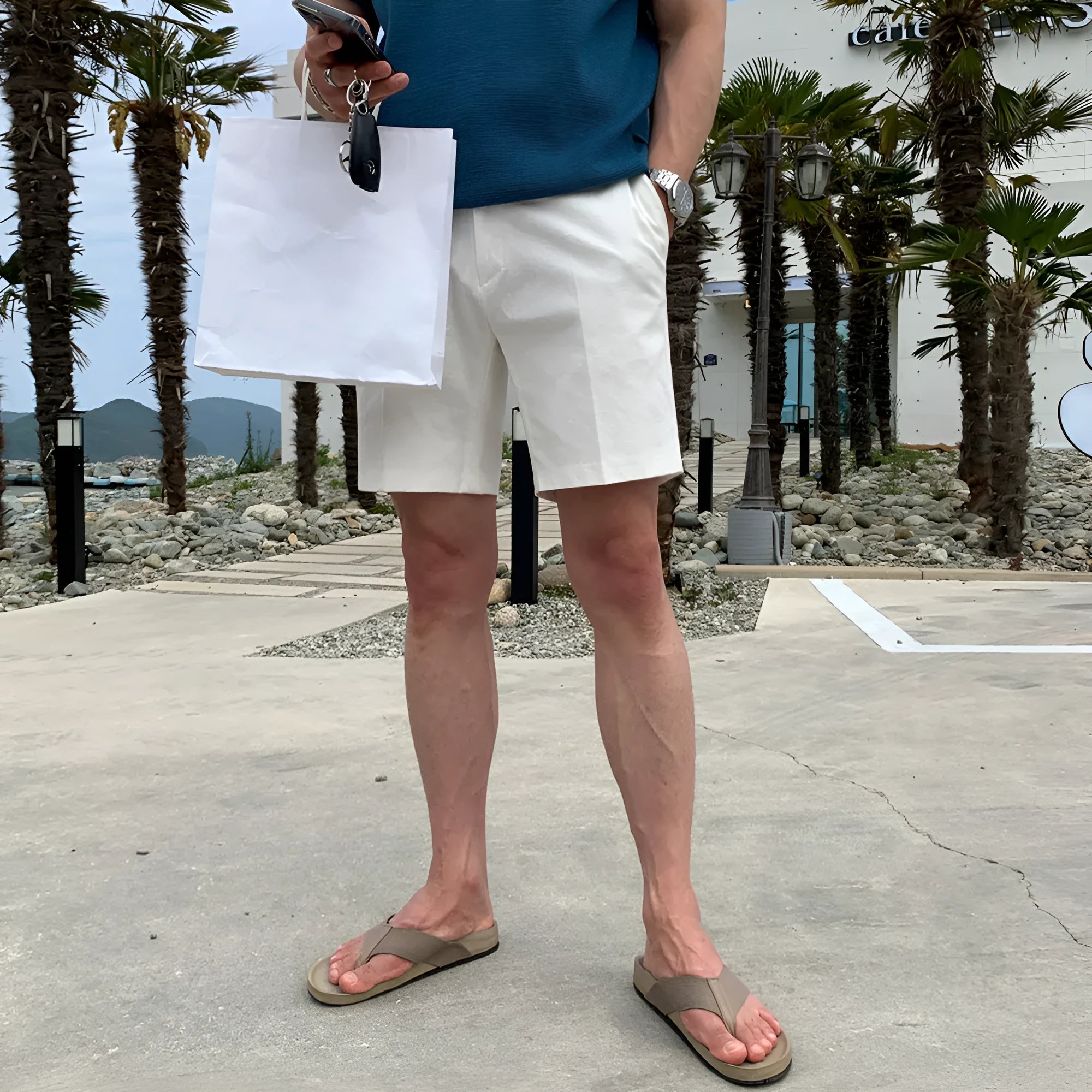Men's straight-leg casual shorts in polyester fabric available in black, white and khaki colours